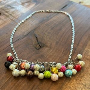 Handmade necklace. Colorful beads. Owned for a few years and has not tarnished.